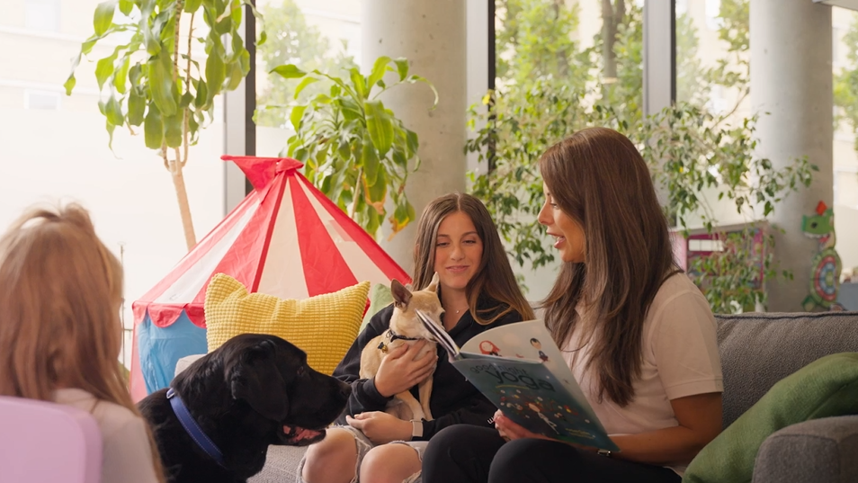 @ girls sitting on the floor beside a tent