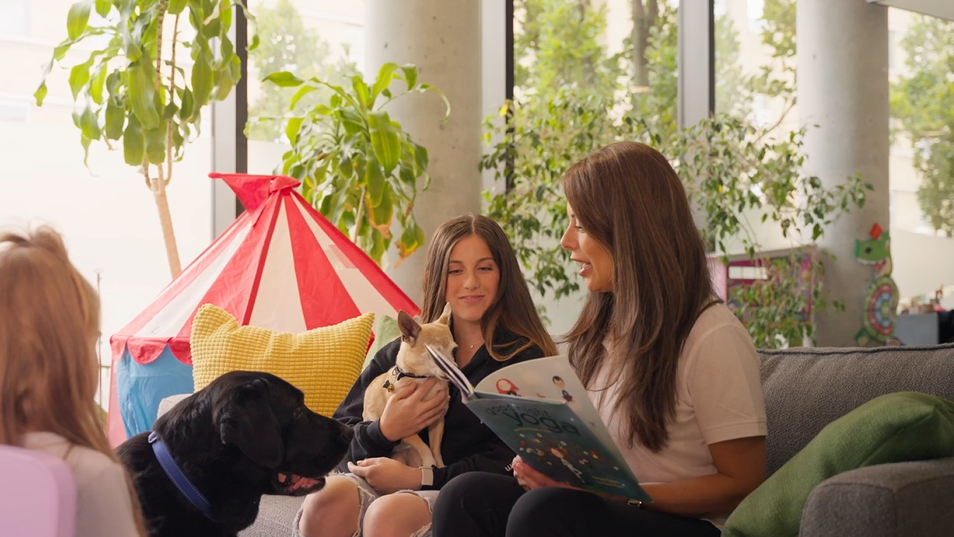 @ girls sitting on the floor beside a tent